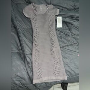 New with tags bodycon style dress. Gray color never worn